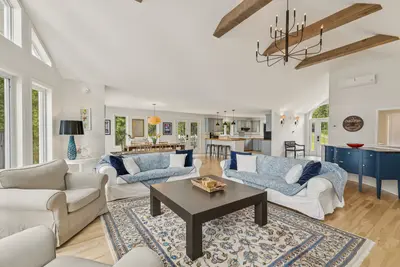 Cathedral-ceiling living room at Chalet Beach House — Lac-Simon, Quebec