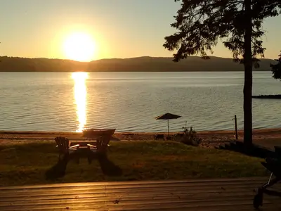 Rear deck at sunset over Lac-Simon — Chalet Beach House — Lac-Simon, Laurentians