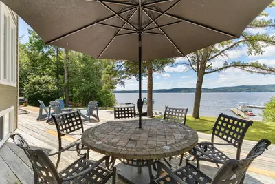 Alfresco dining on the lakefront terrace — Chalet Beach House — Lac-Simon, Outaouais