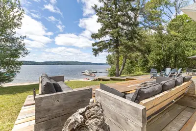 Outdoor lounge with open Lac-Simon view — Chalet Beach House — Lac-Simon, Laurentians