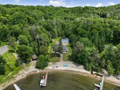 Aerial view of the chalet with private beach — Chalet Beach House — Lac-Simon, Laurentians